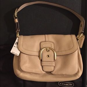 NWT Coach leather purse with brass hardware.